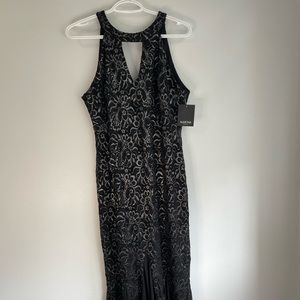 Black long classy dress with glittery silver flowers up and down it